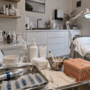 Professional skincare clinic with microneedling tools, LED mask and treatment bed.